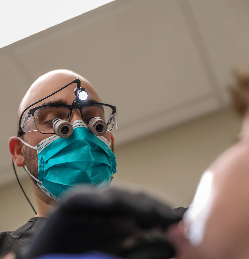 wisdom teeth being taken out of patients mouth
