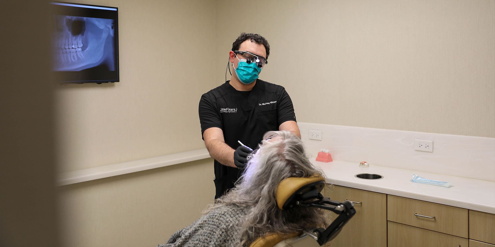 Doctor working on patients teeth