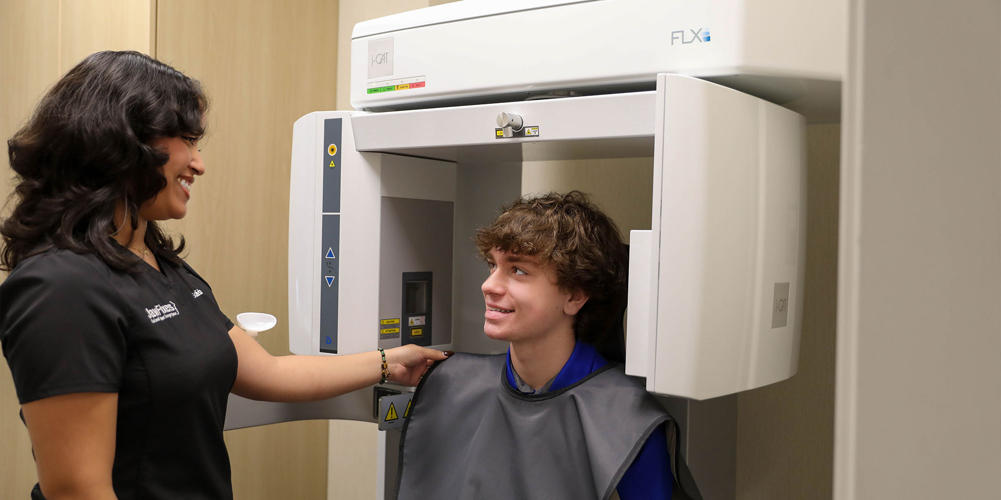 doctor setting patient up to take x-rays of their teeth
