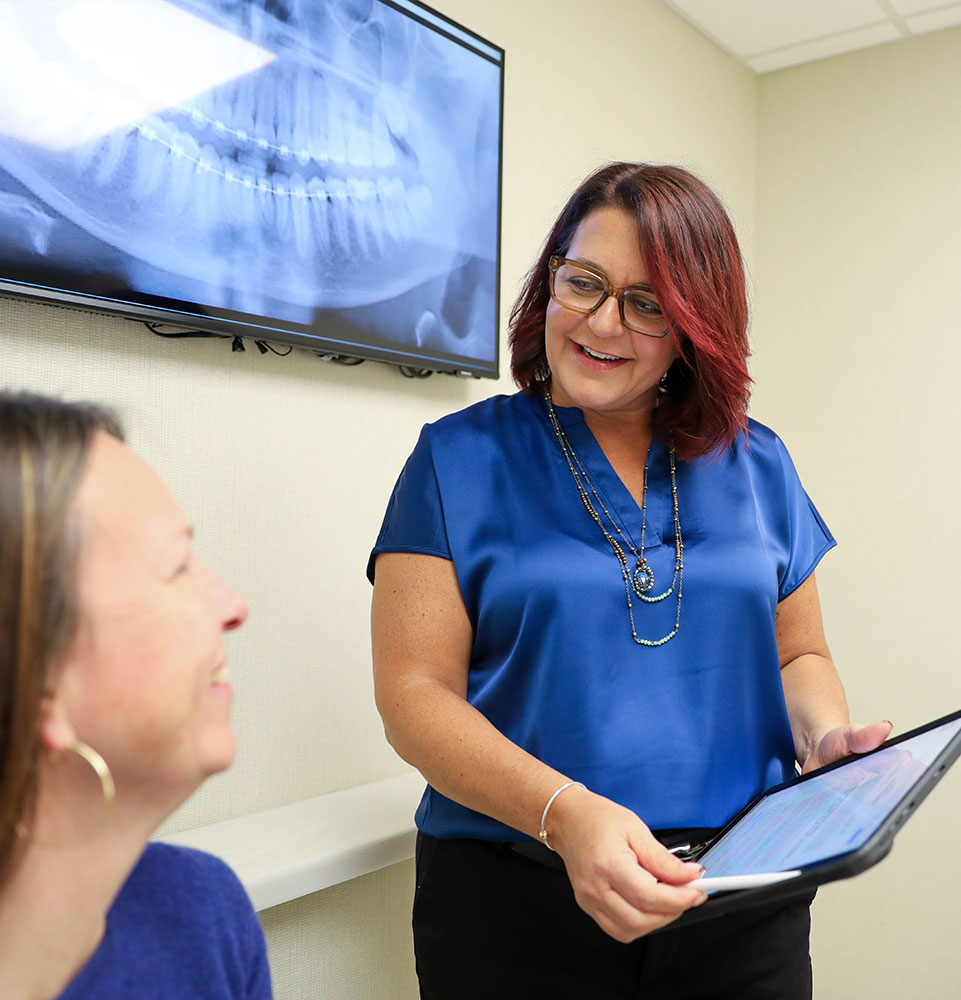 staff member talking to patient