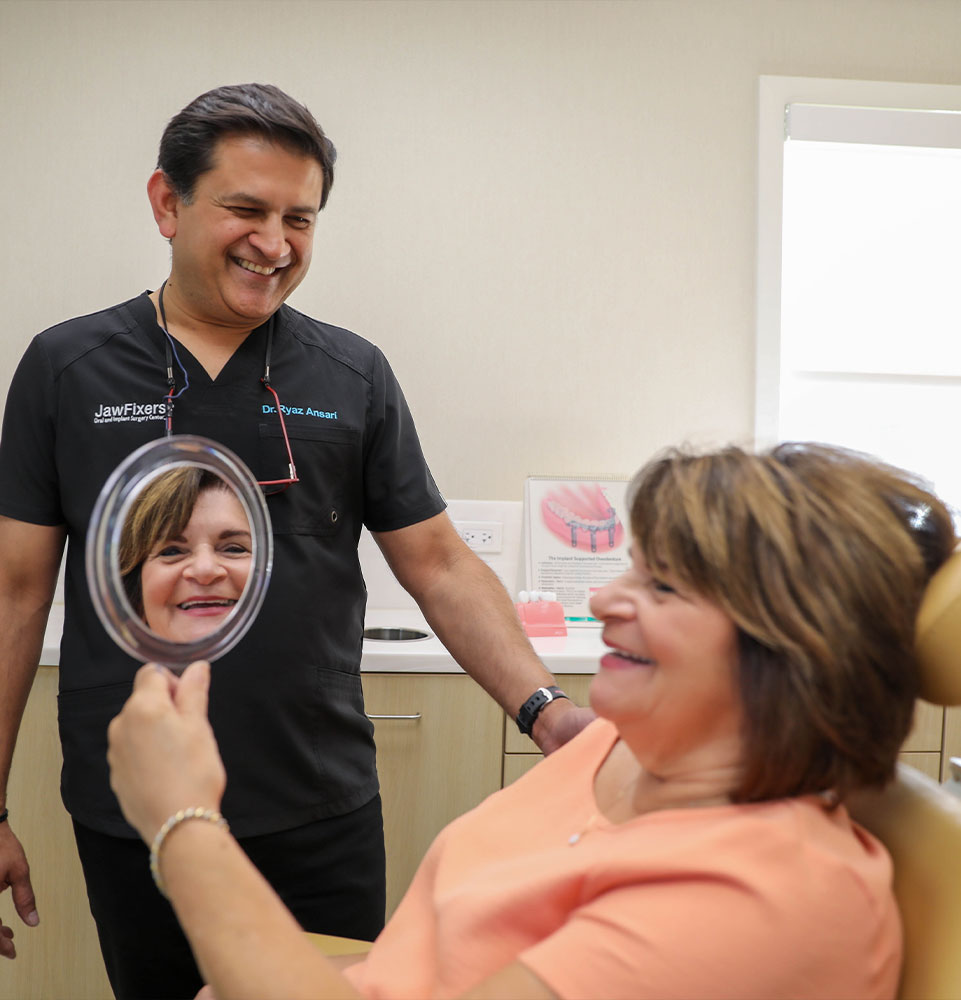 Dr. Ansari Ryaz and patient smiling